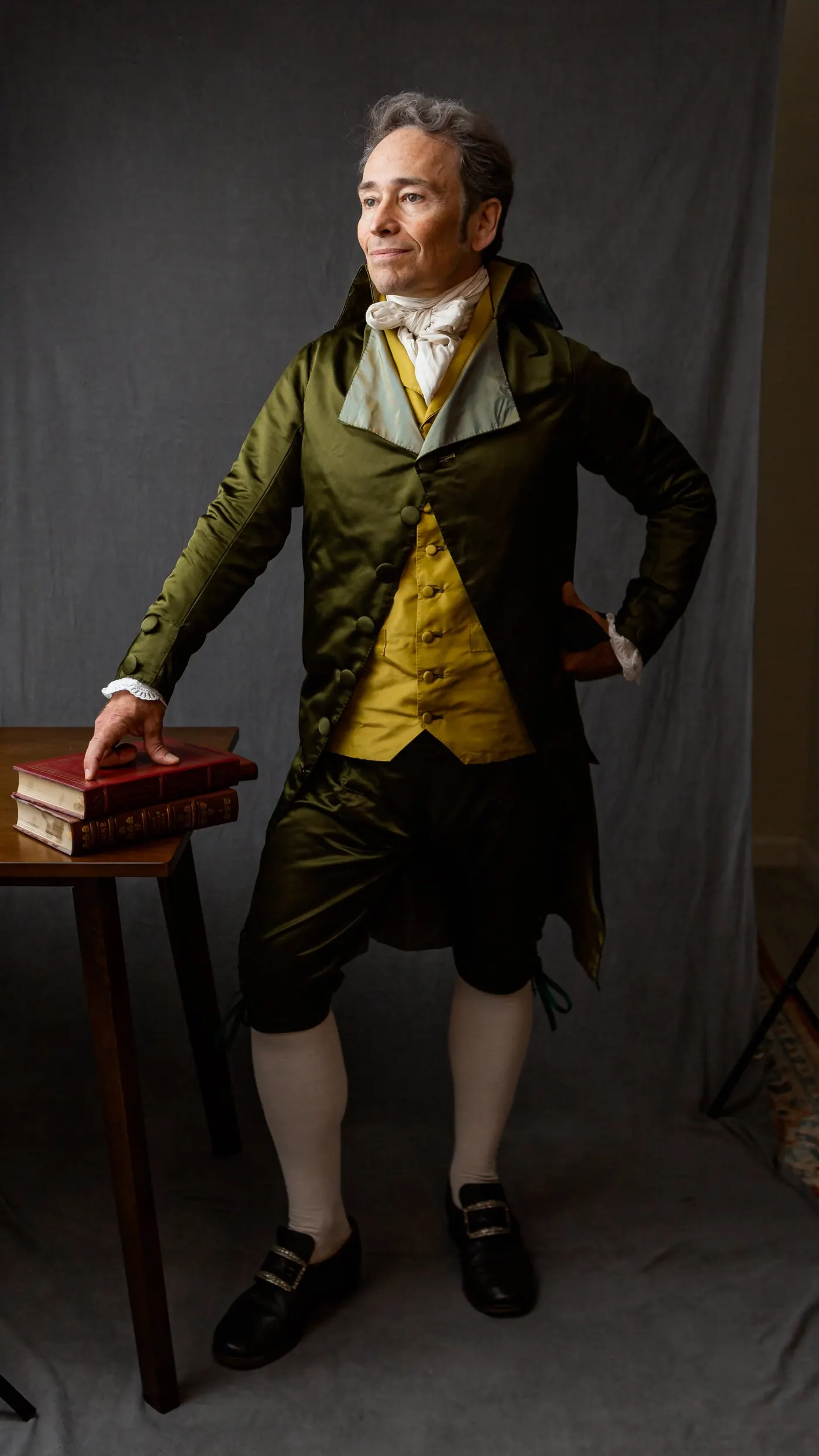 Full-length studio portrait in satin formal attire